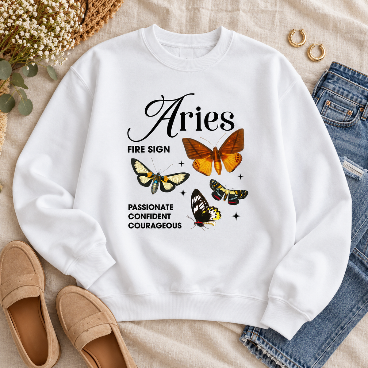 Aries Collage Sweater in a styled lifestyle flat lay