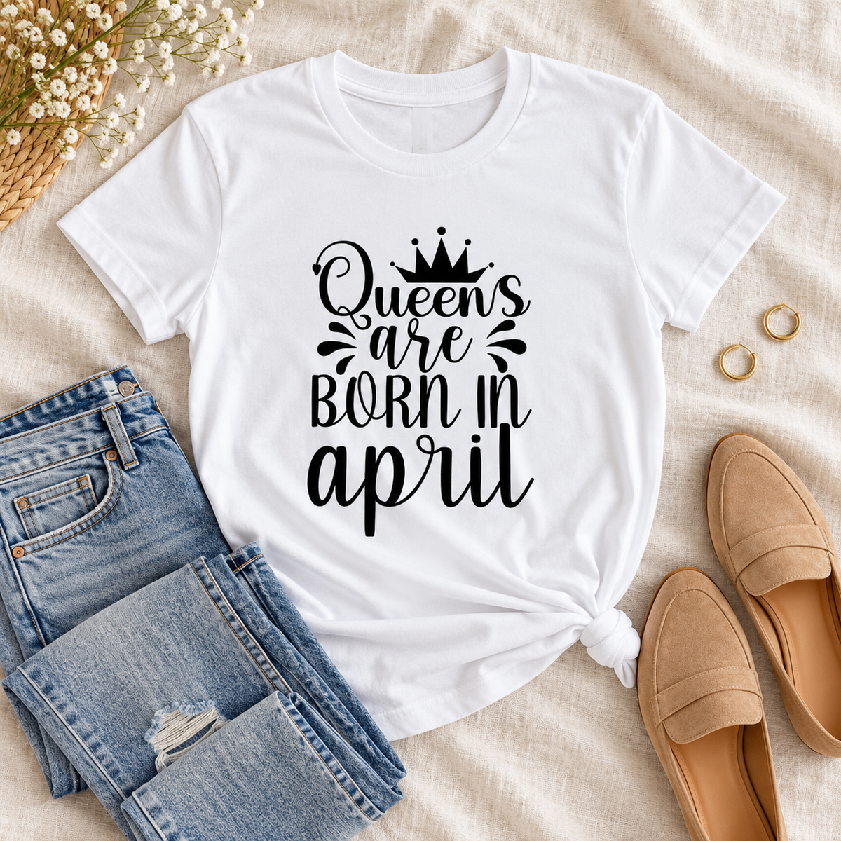 Queens Are Born in April Tee 👑 in a styled lifestyle flat lay