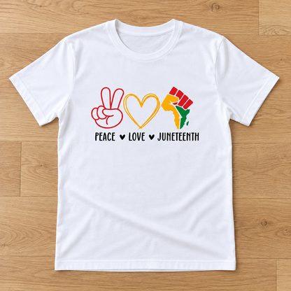 White Peace Love Juneteenth — Symbols Tee laid flat on light wood