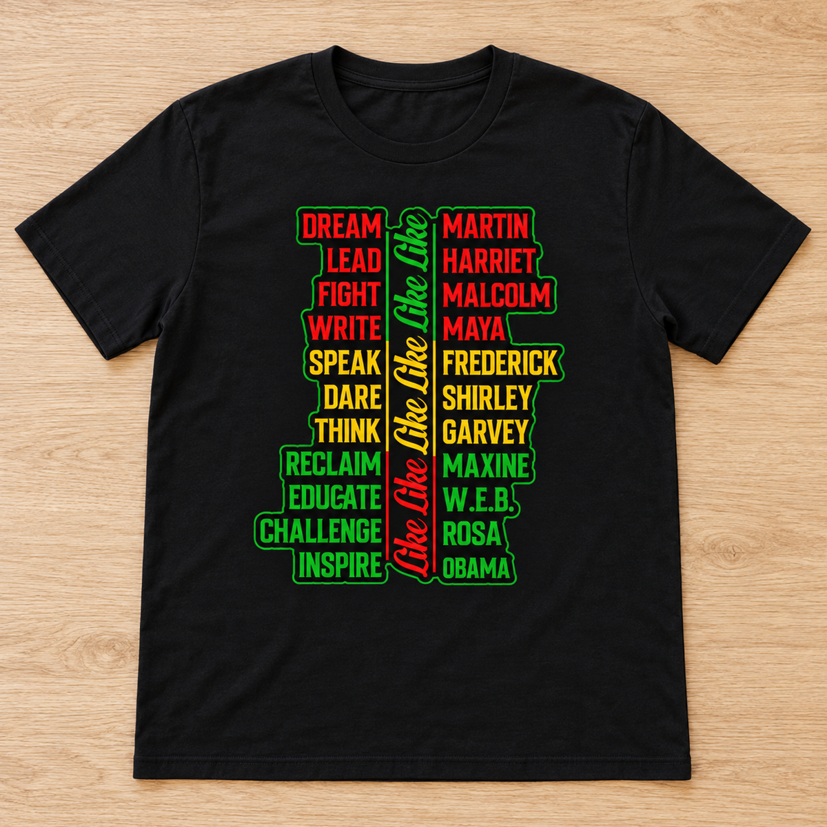 Black Legacy of Greatness: Juneteenth Leaders Tee laid flat on light wood