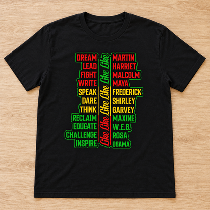 Black Legacy of Greatness: Juneteenth Leaders Tee laid flat on light wood