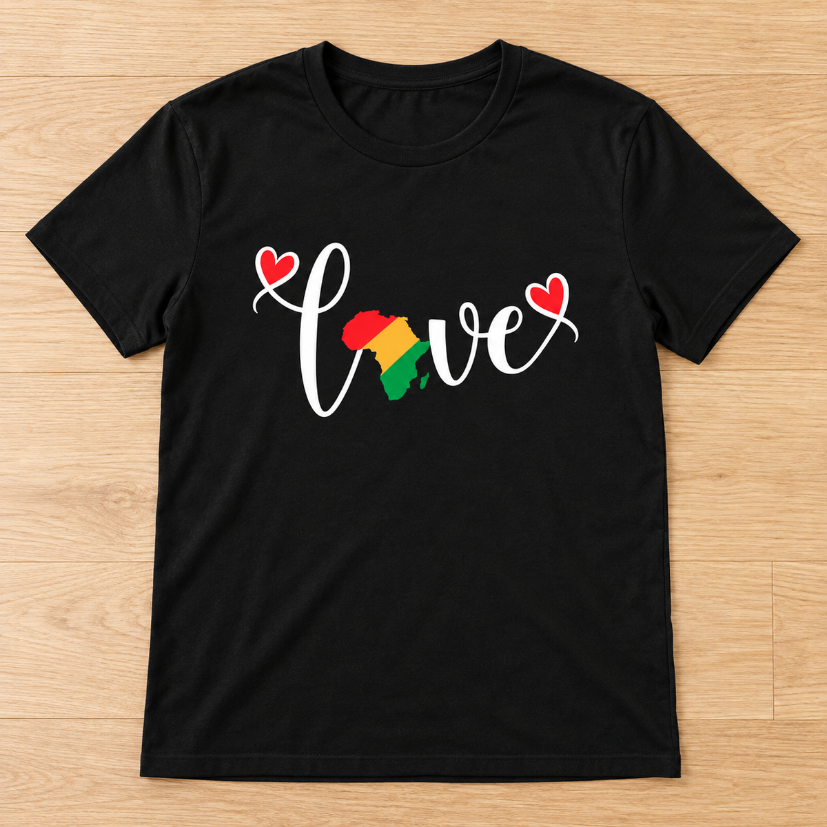 Black Love & Juneteenth Africa Graphic Tee laid flat on light wood