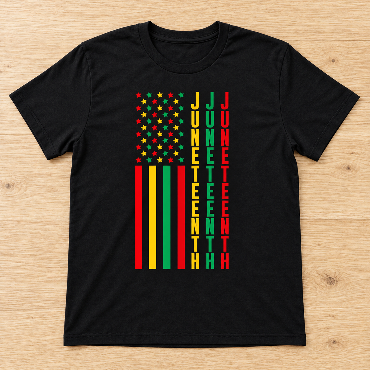 Black Juneteenth Stars & Stripes Tee laid flat on light wood