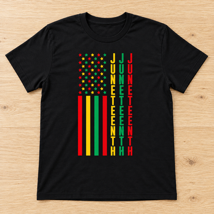 Black Juneteenth Stars & Stripes Tee laid flat on light wood
