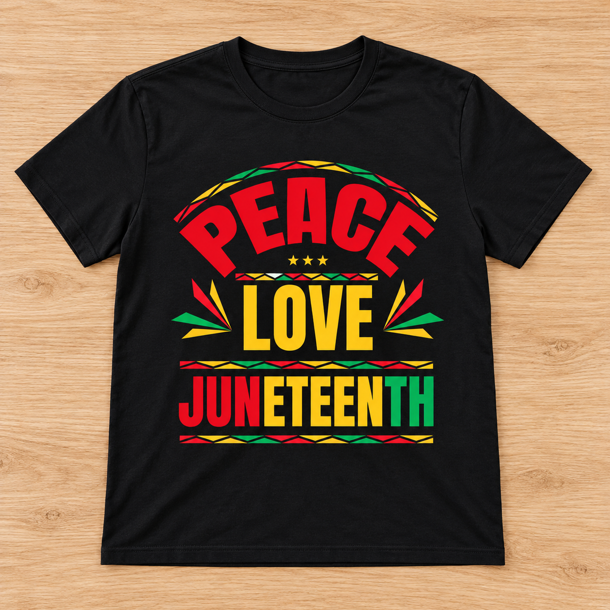 Black Peace Love Juneteenth — Bold Typography Tee laid flat on light wood