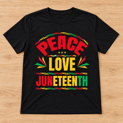Black Peace Love Juneteenth — Bold Typography Tee laid flat on light wood