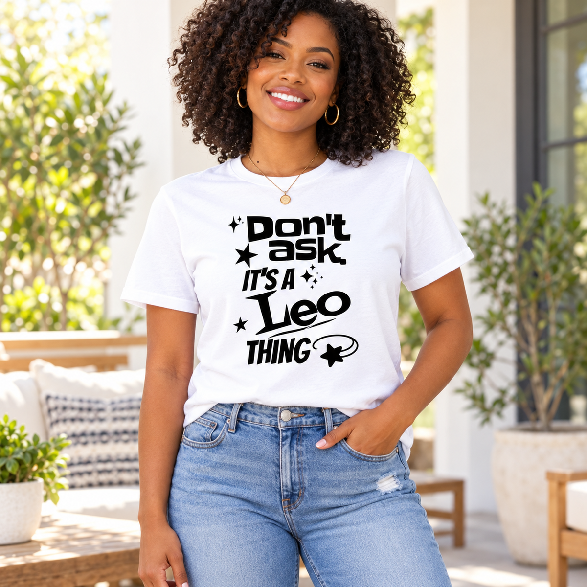 Black woman wearing a white graphic tee