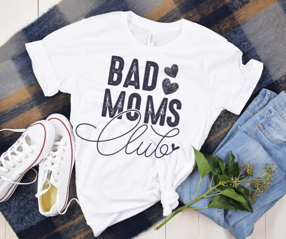 Bad Moms Club Tee — styled flat lay showing the front design