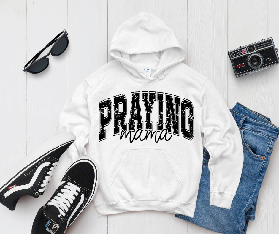 Praying Mama Hoodie — styled flat lay showing the front design