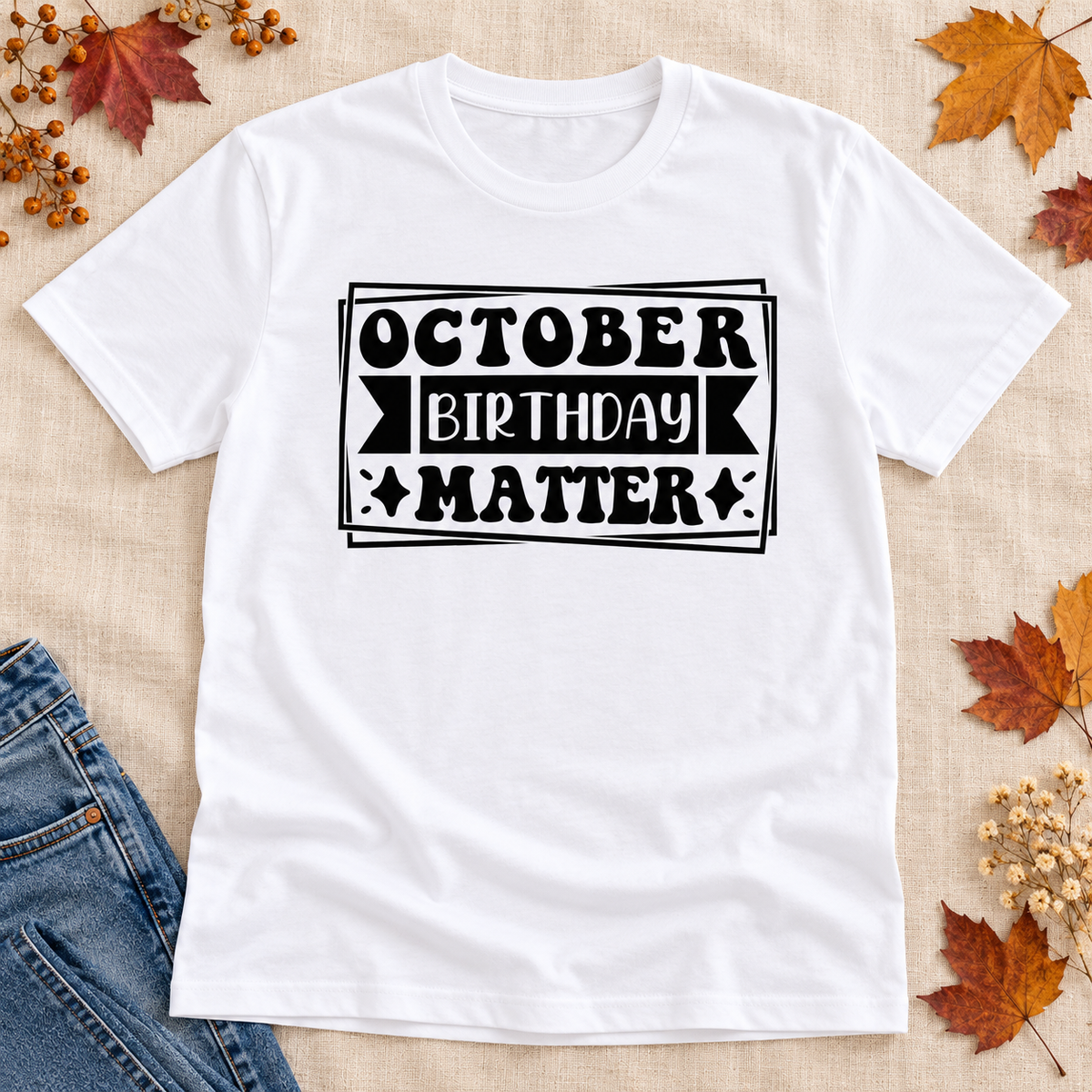 October Birthday Matter Tee — styled tee flat lay