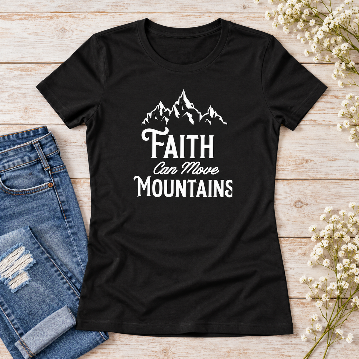 Faith Can Move Mountains Women's Tee — styled flat lay showing the front design