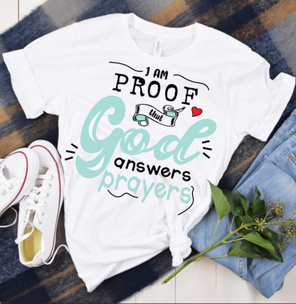 God Answers Prayers Tee — styled flat lay showing the front design